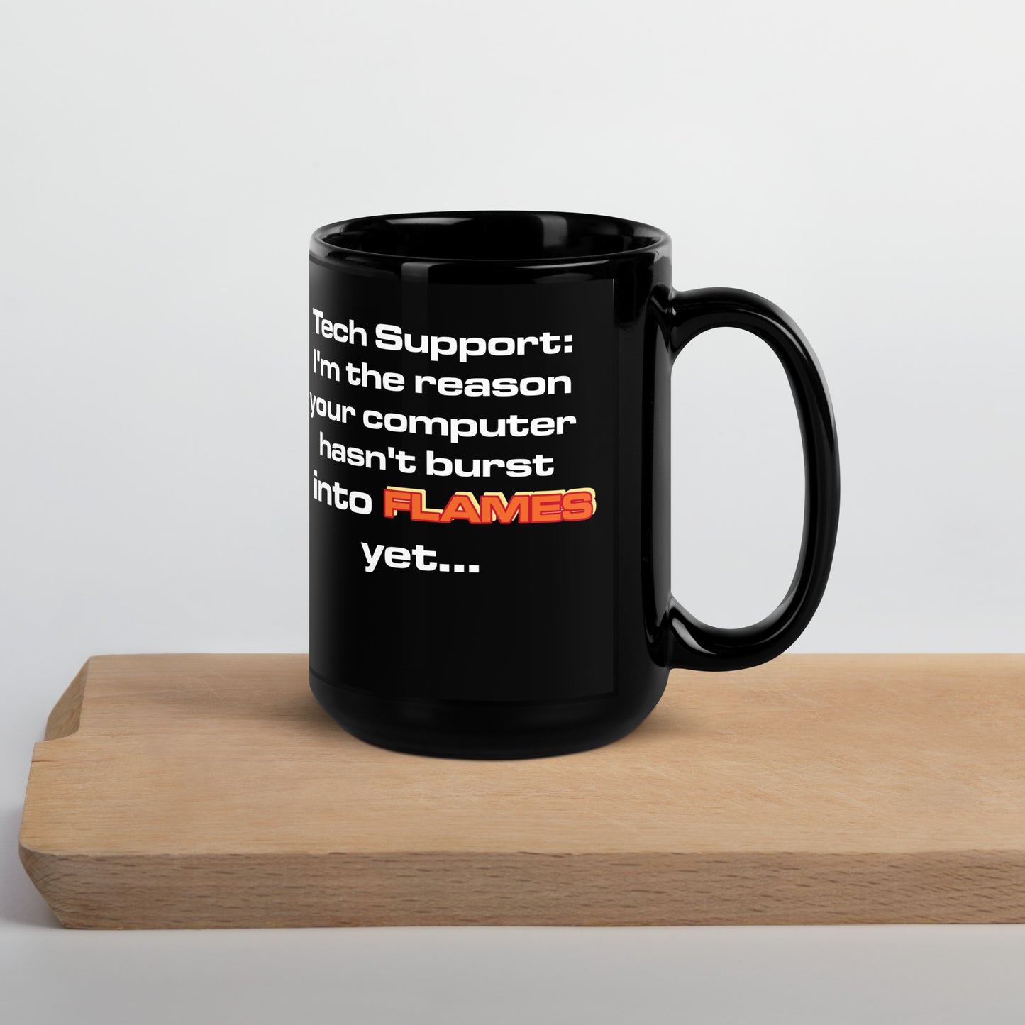 Black mug with funny tech support flames design, perfect for sysadmins and developers.