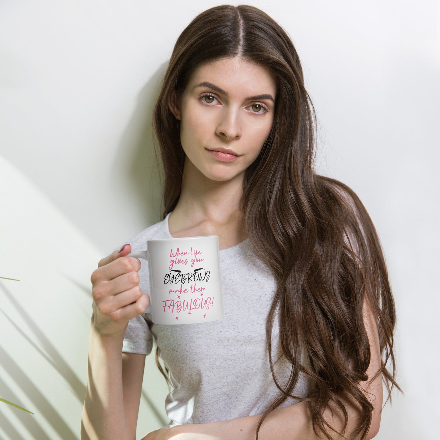 Makeup-themed white mug with eyebrow humor, great gift for beauty lovers and stylists.